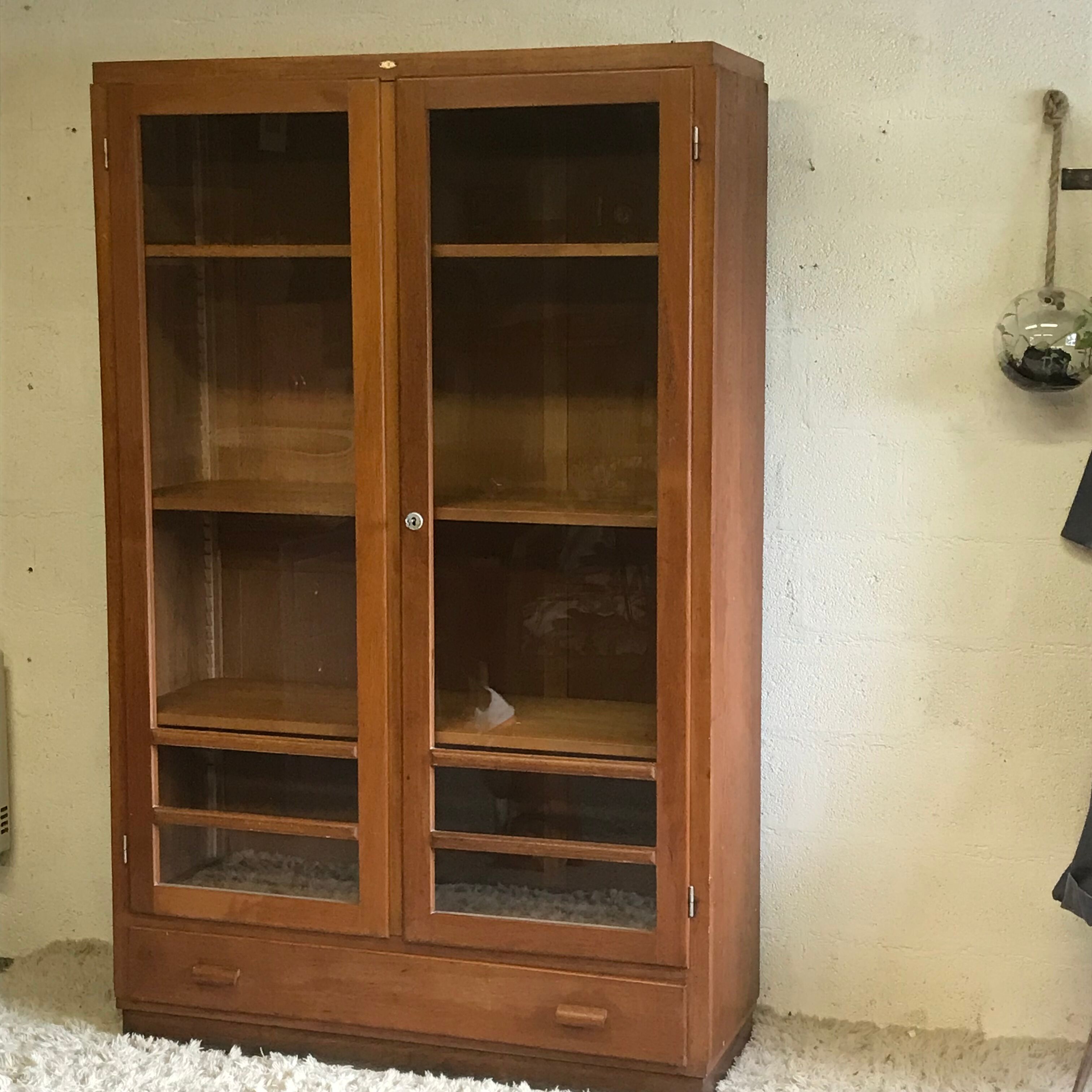 Old school glass bookcase in blond wood