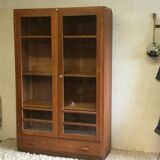 Old school glass bookcase in blond wood