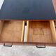 French modernist desk from the 1950s with 2 drawers, 1 cabinet, and 1 container.