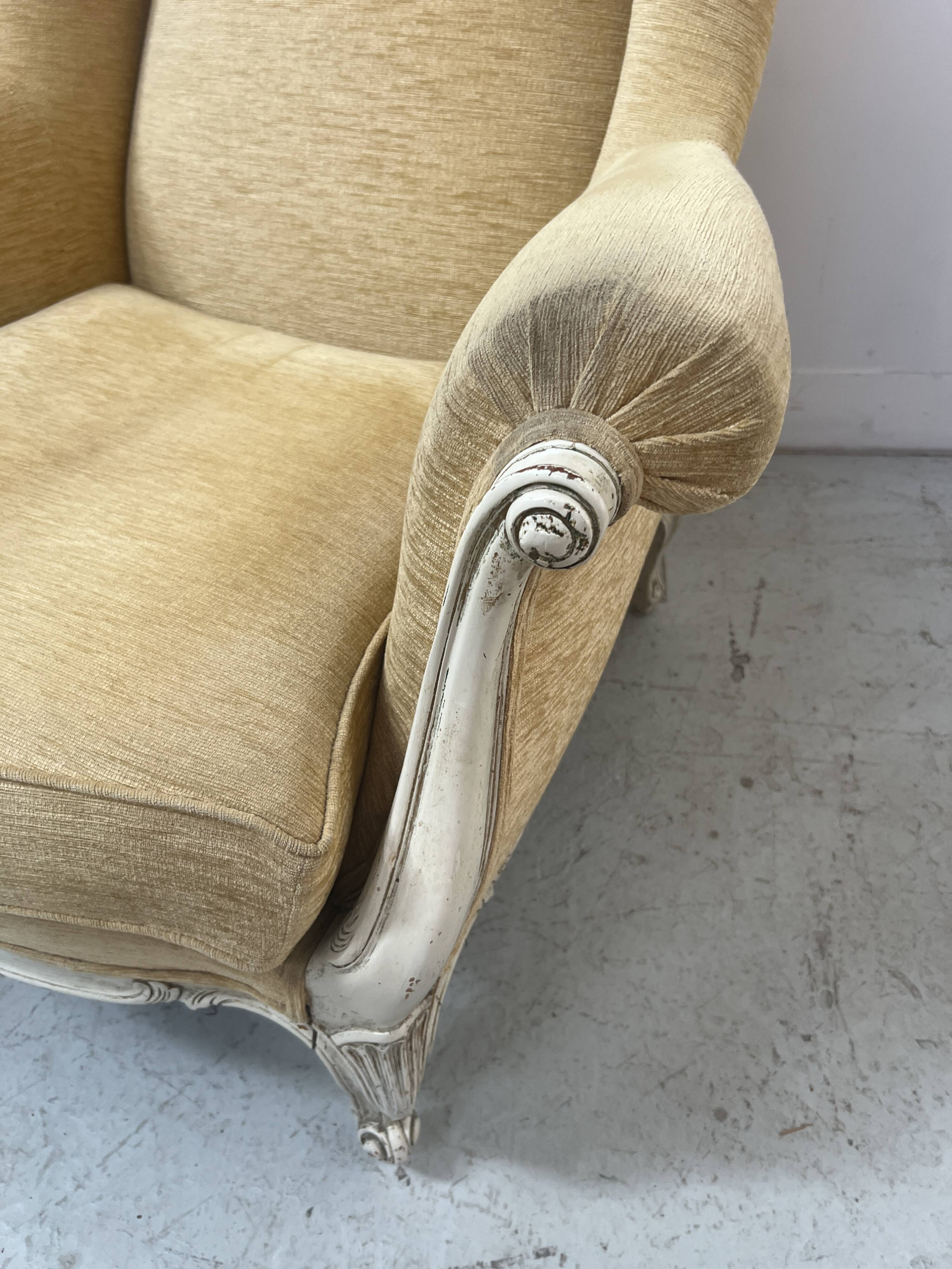 Pair of Louis XV style wing chairs in patinated beech, 20th century