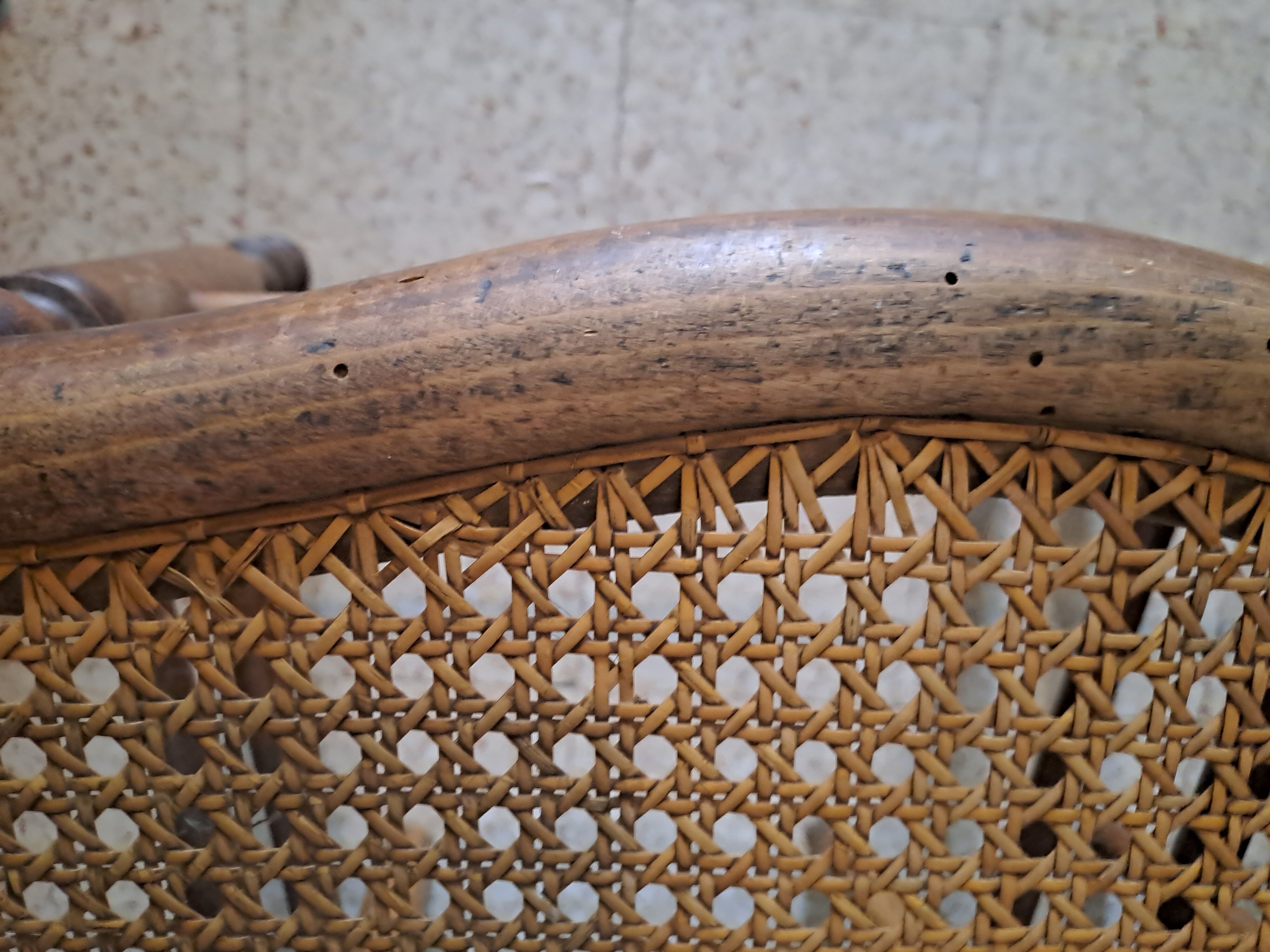 Pair of 1950s light wood bistro chairs with cane seats