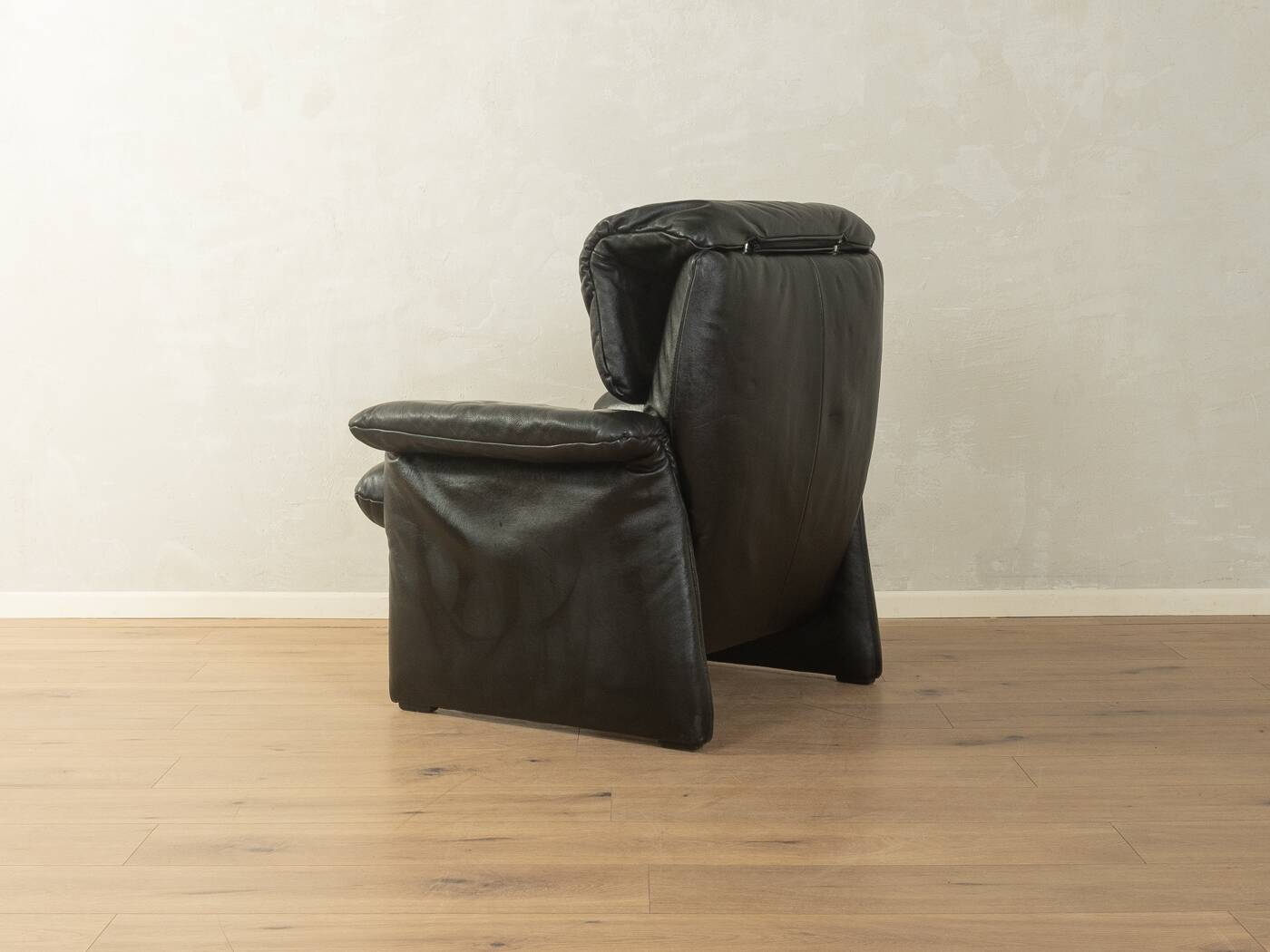 1980s cor armchair and ottoman in black leather