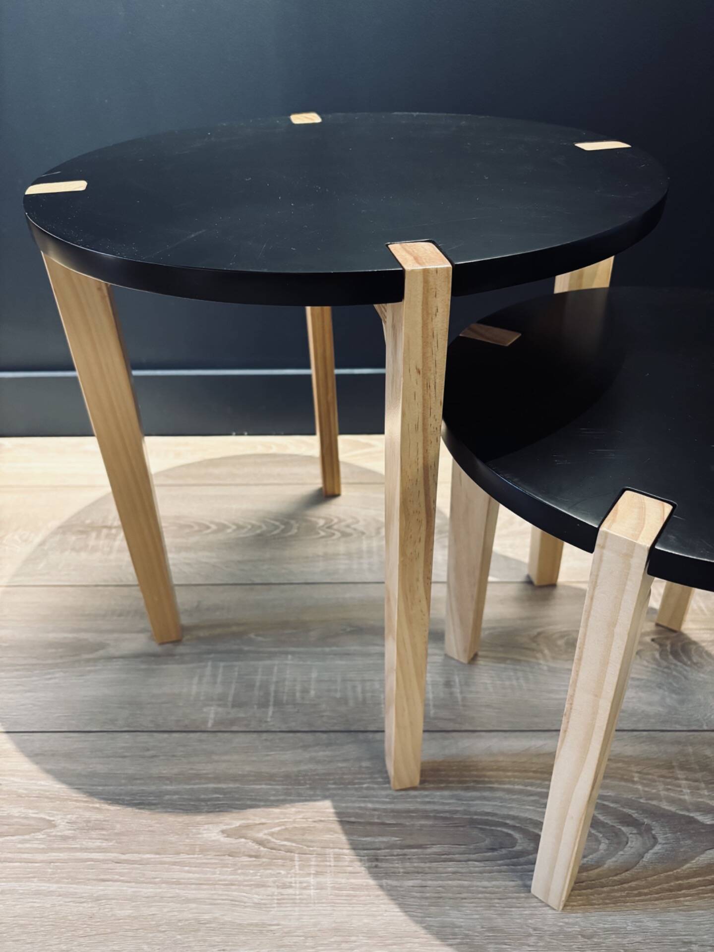 Set of round wooden and black side tables – Scandinavian style
