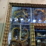 Venetian mirror in eglomise glass and gilded wood