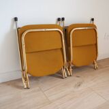 2 Vintage Eyrel folding chairs in mustard yellow and gold – Chic retro design