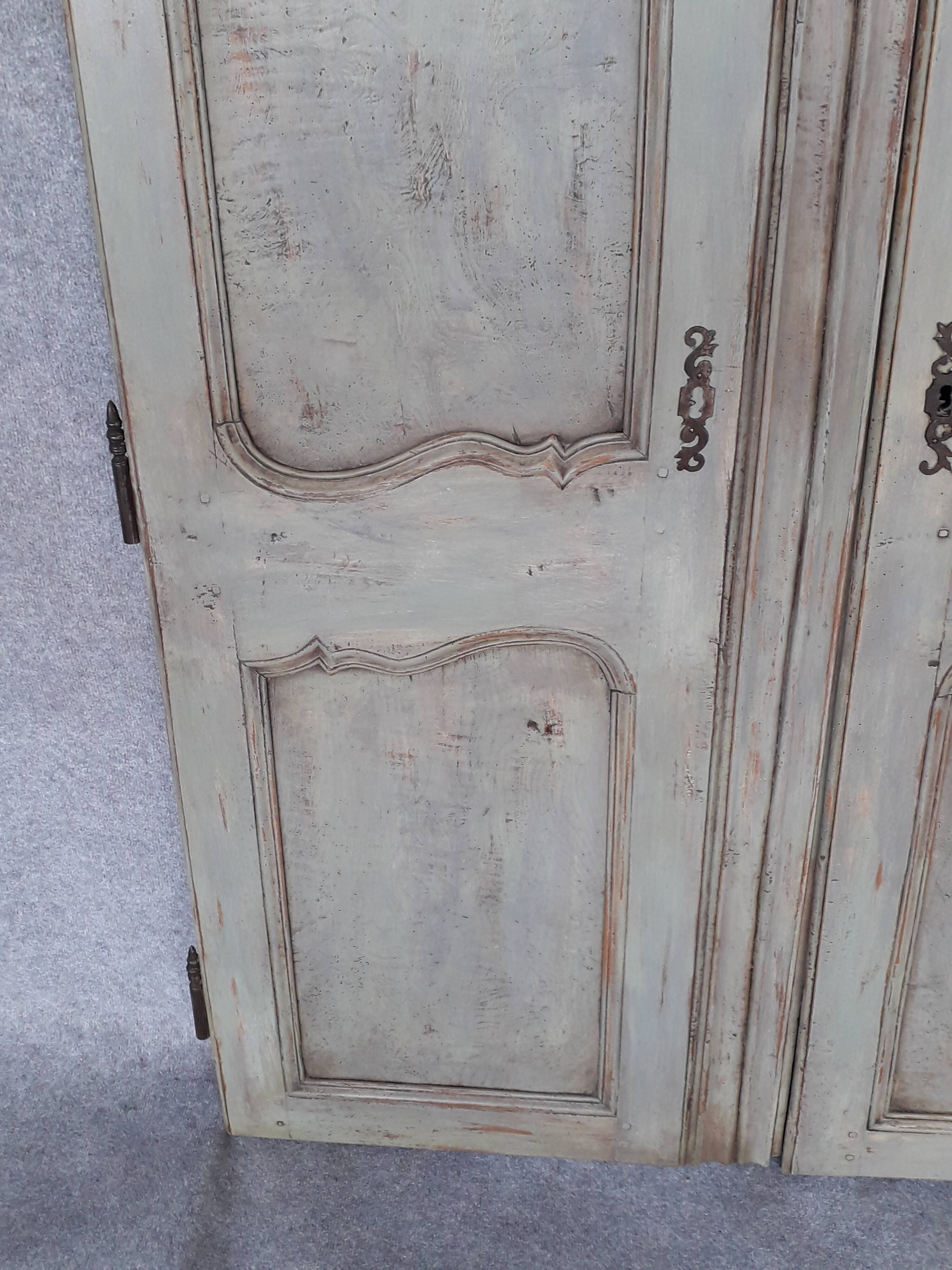 Pair of Louis XV period walnut and ash cabinet doors