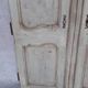 Pair of Louis XV period walnut and ash cabinet doors