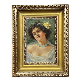Portrait of a young woman. Signed Nevelli.