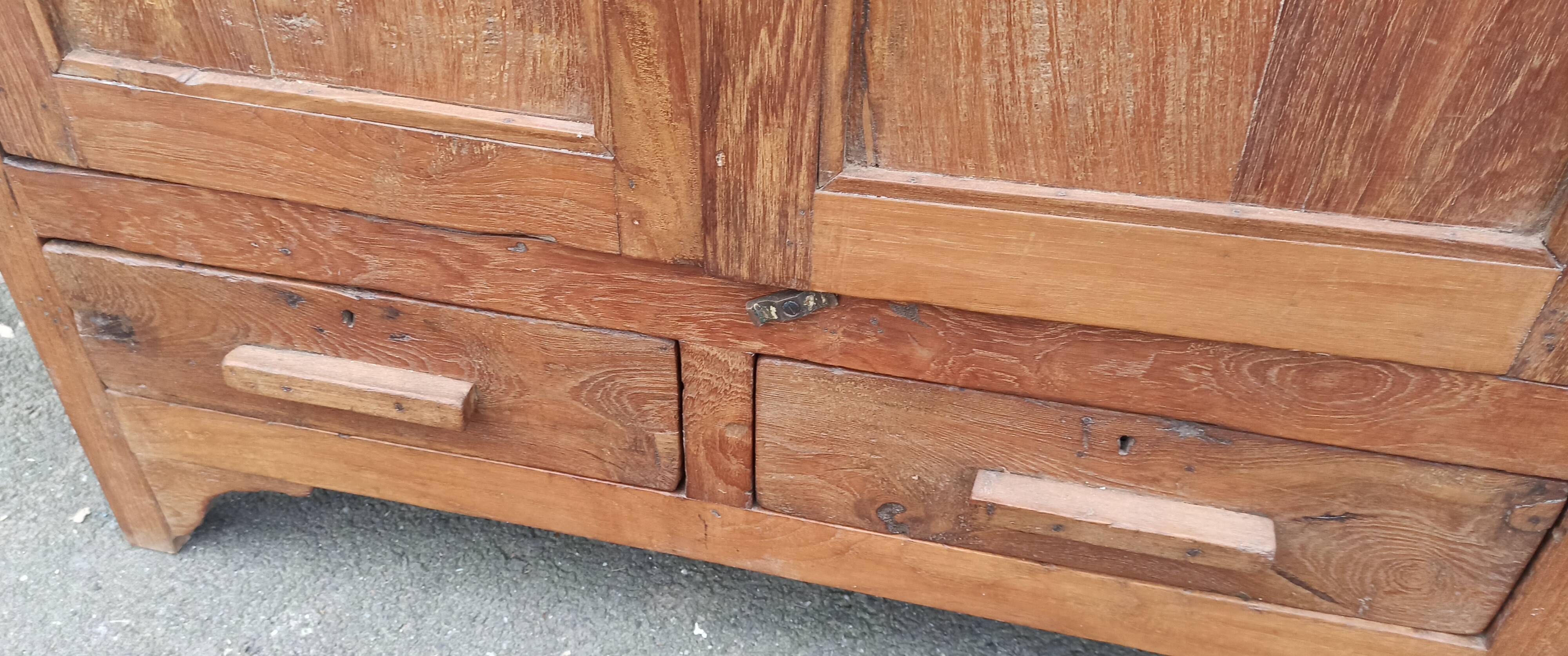 Old glazed teak cabinet