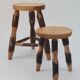 Pair of walnut stools sculpted in a vintage mid-century cross-section.