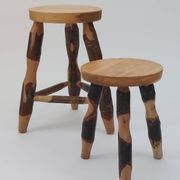 Pair of walnut stools sculpted in a vintage mid-century cross-section.
