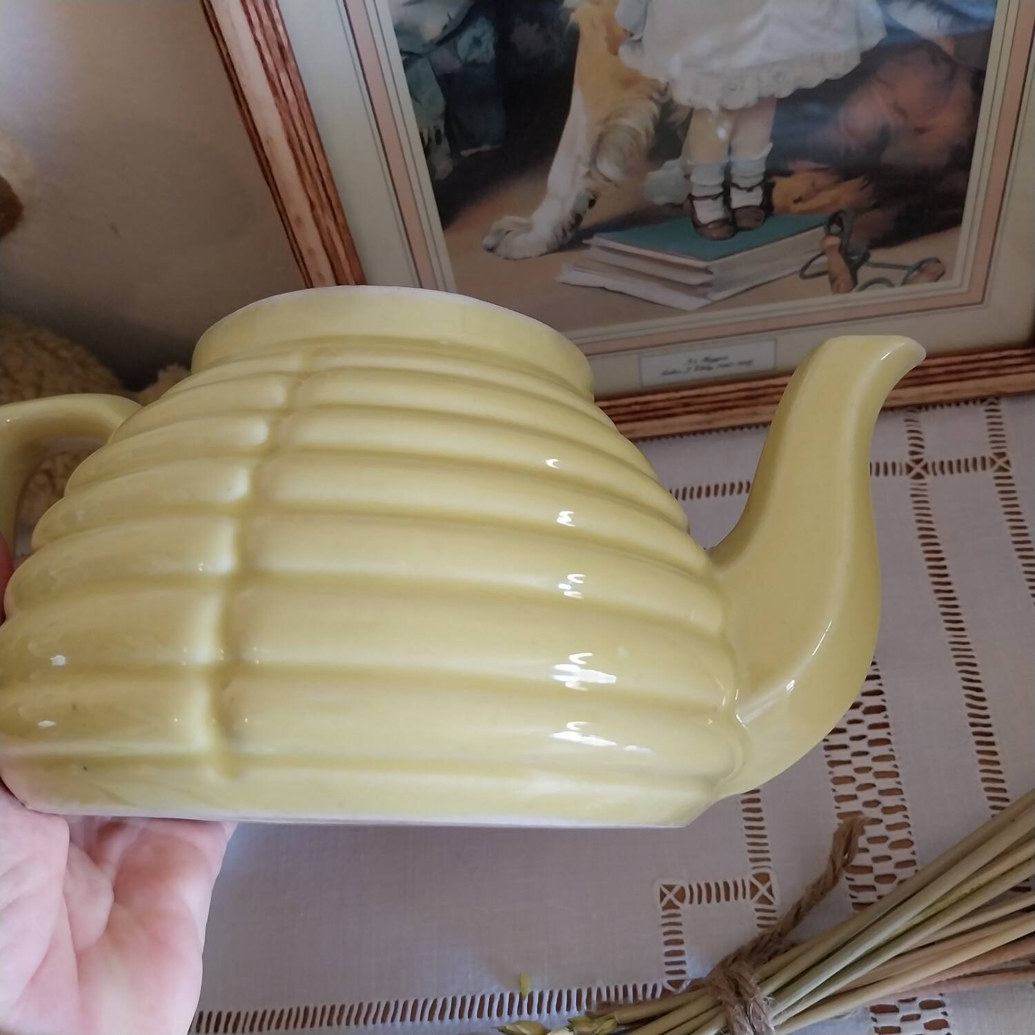 Old yellow earthenware teapot