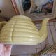 Old yellow earthenware teapot