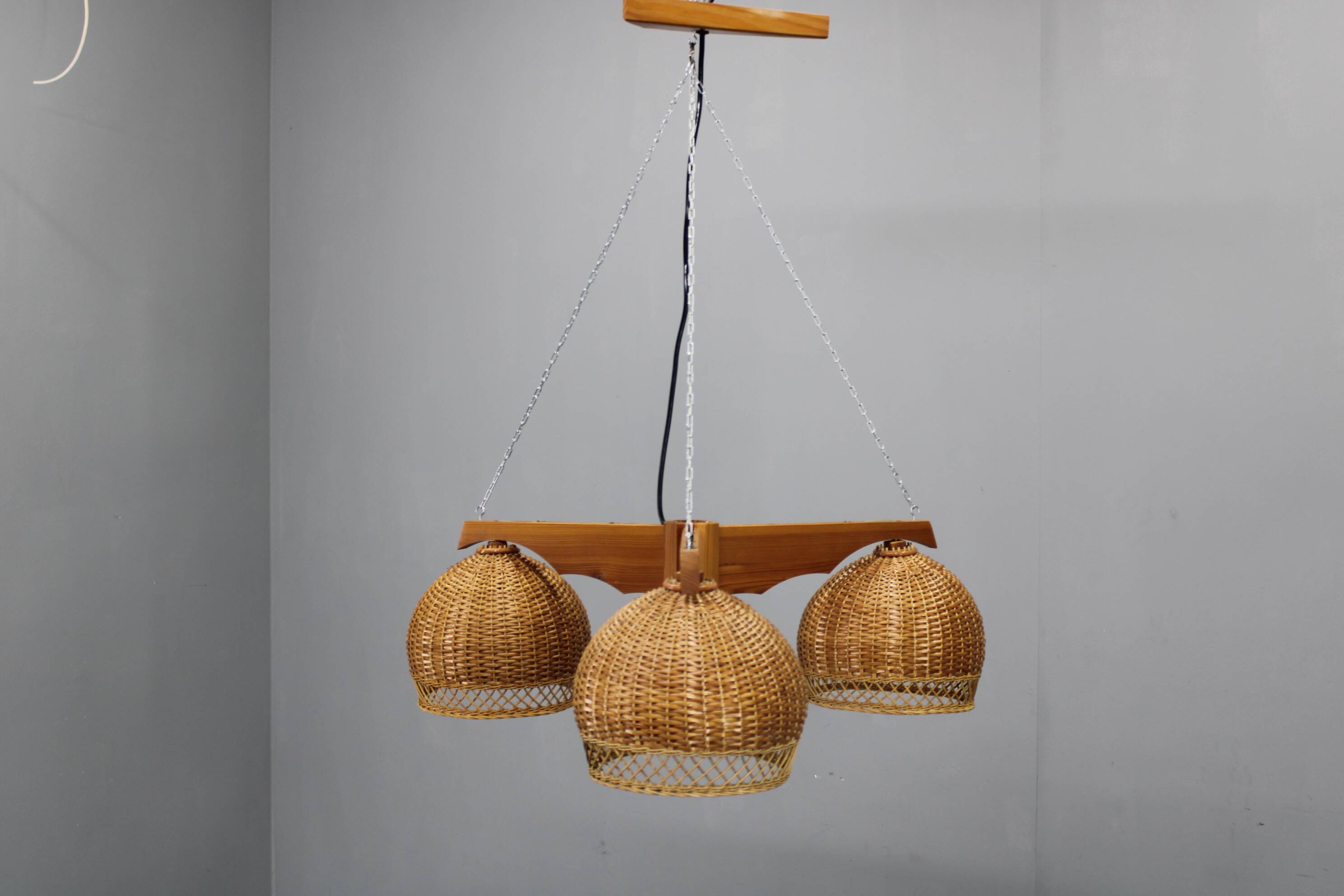 1970s Czechoslovakian rattan & pine pendant light, three-shade chandelier