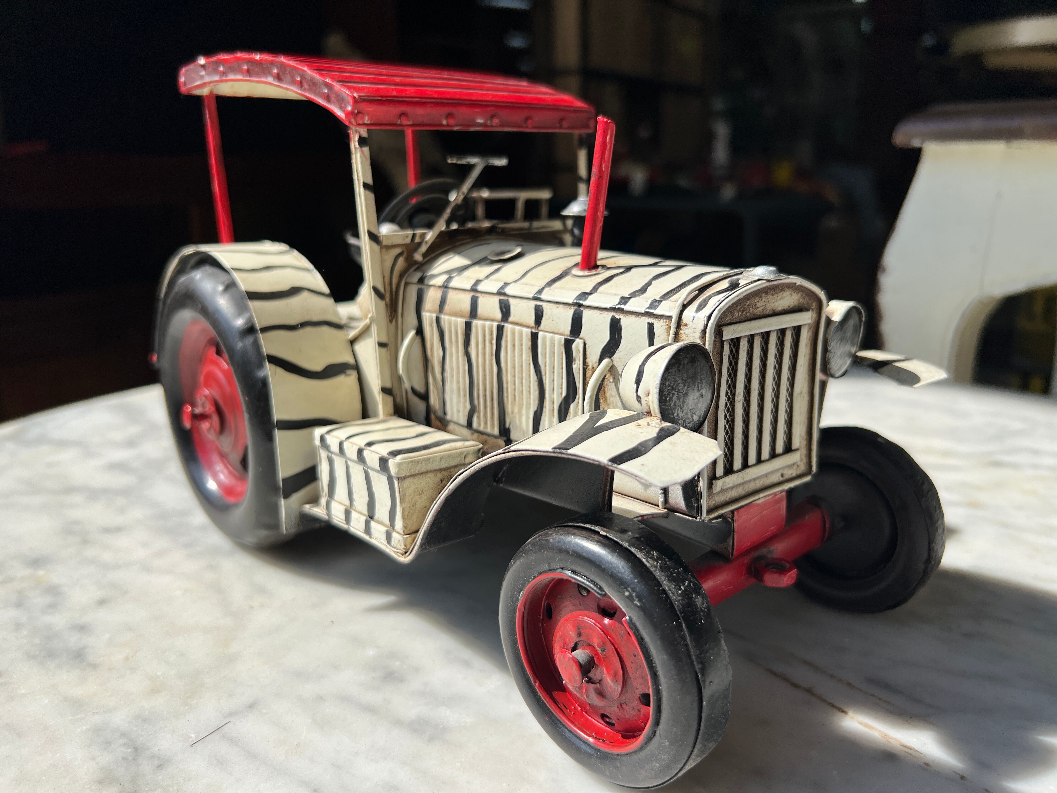 Old zebra metal tractor