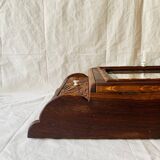 Old carved wooden medicine cabinet with beveled mirror