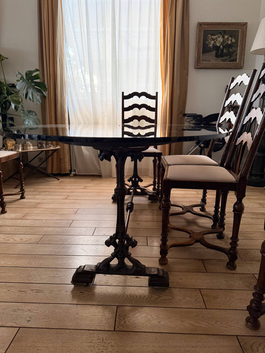 Large antique dining table in wrought iron and smoked glass,