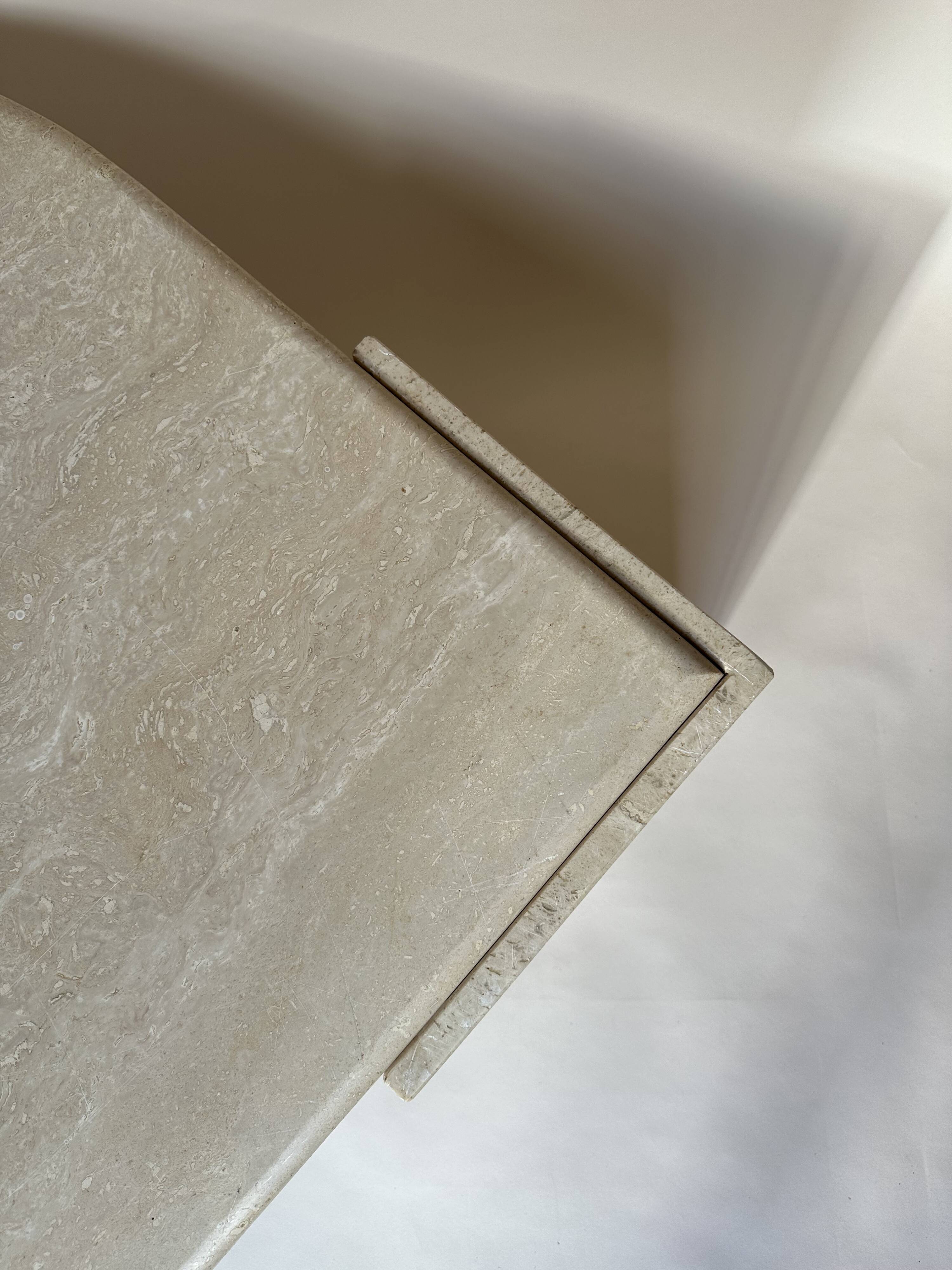 Travertine eye-shaped coffee table