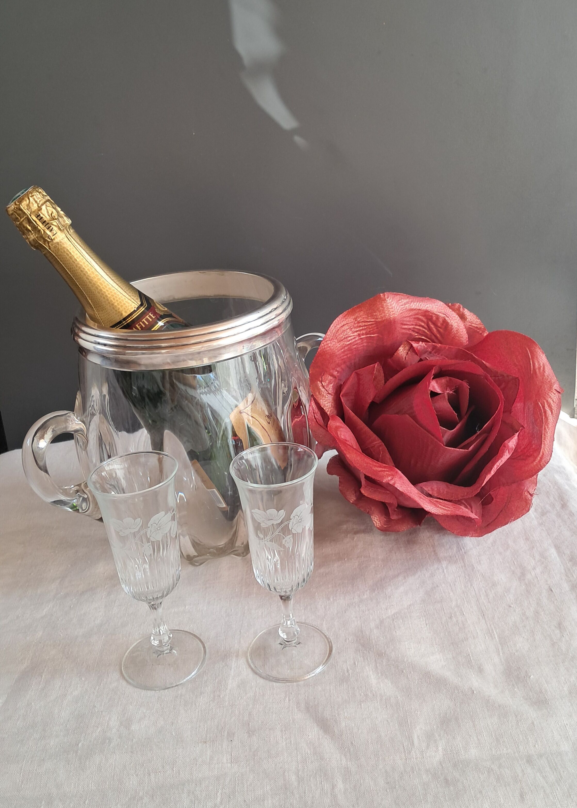Twisted moulded glass bistro champagne bucket with a silver metal collar.