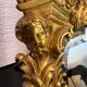 Beveled mirror in gilt bronze