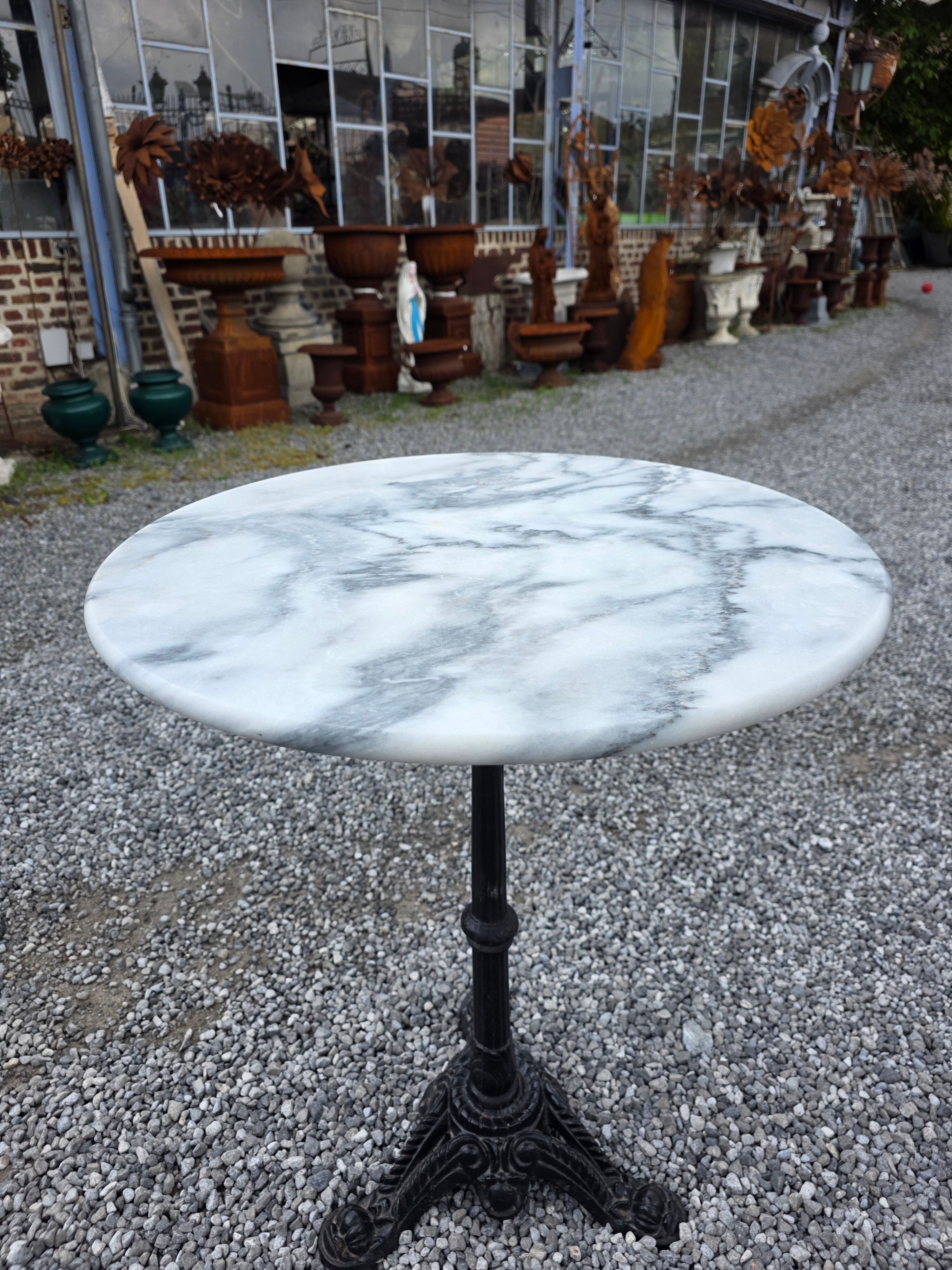 Bistro table with a cast iron base and marble top