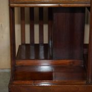Restored Victorian walnut revolving library.