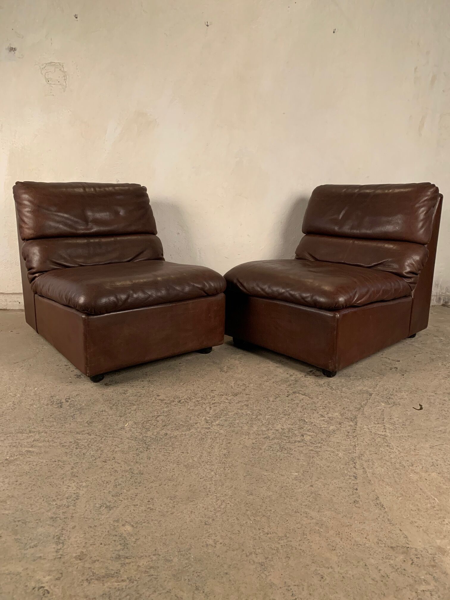 A pair of leather armchairs, Switzerland, 1970s
