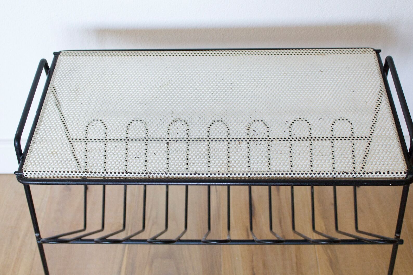 Mid century perorated metal side table with a magazine rack - pilastro tomado artimeta era