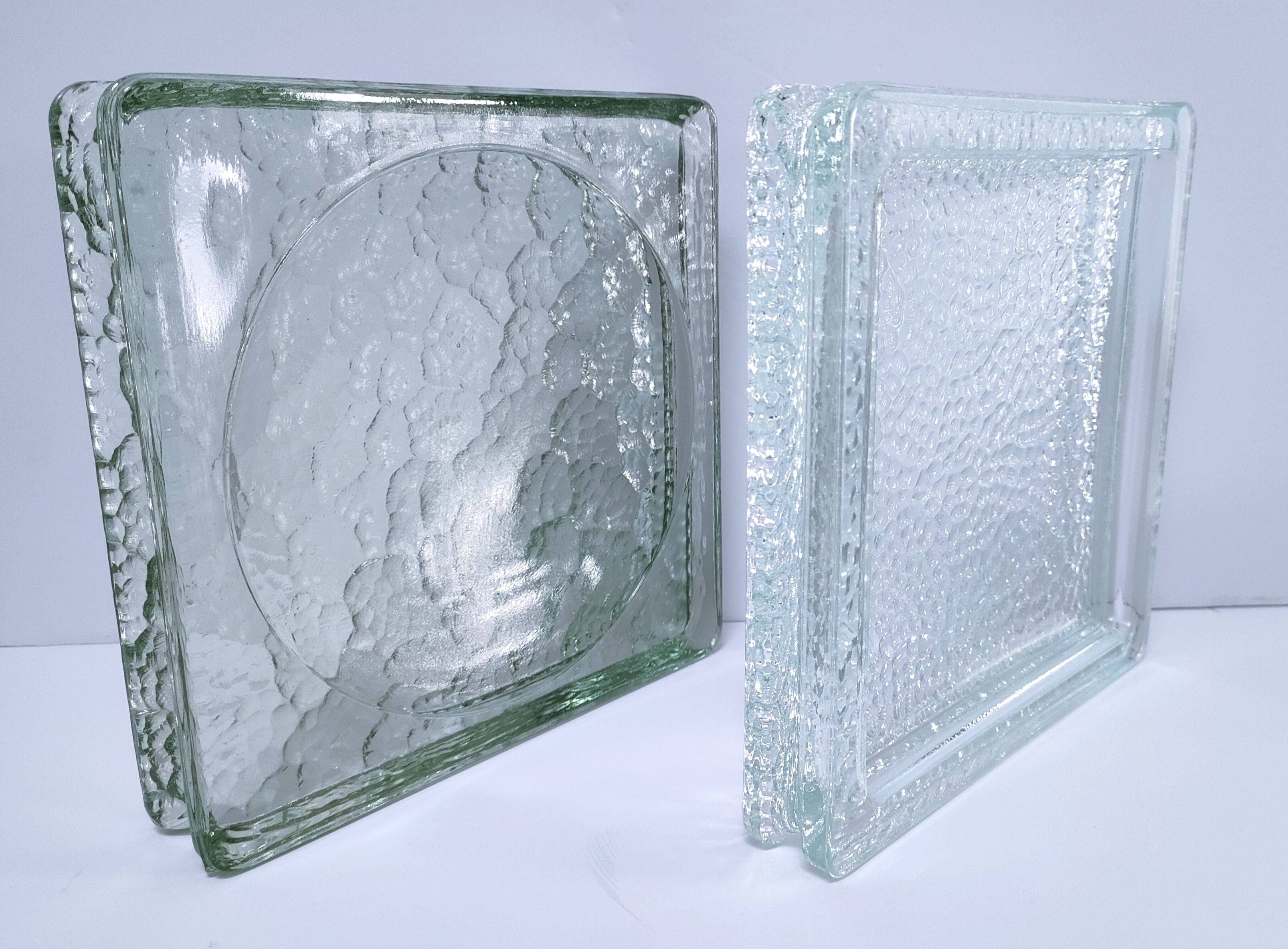 Two designer glass paving pockets