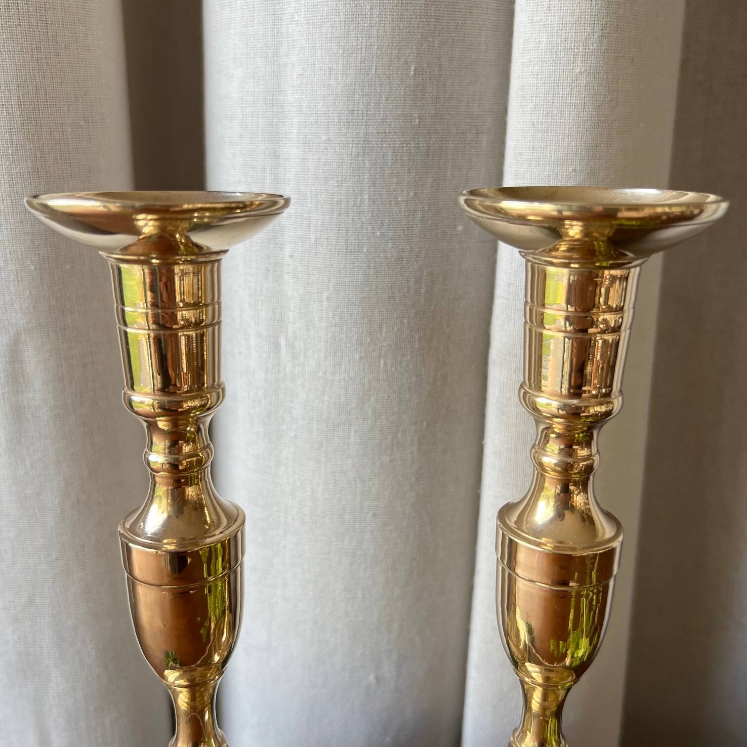 Duo of brass candlesticks