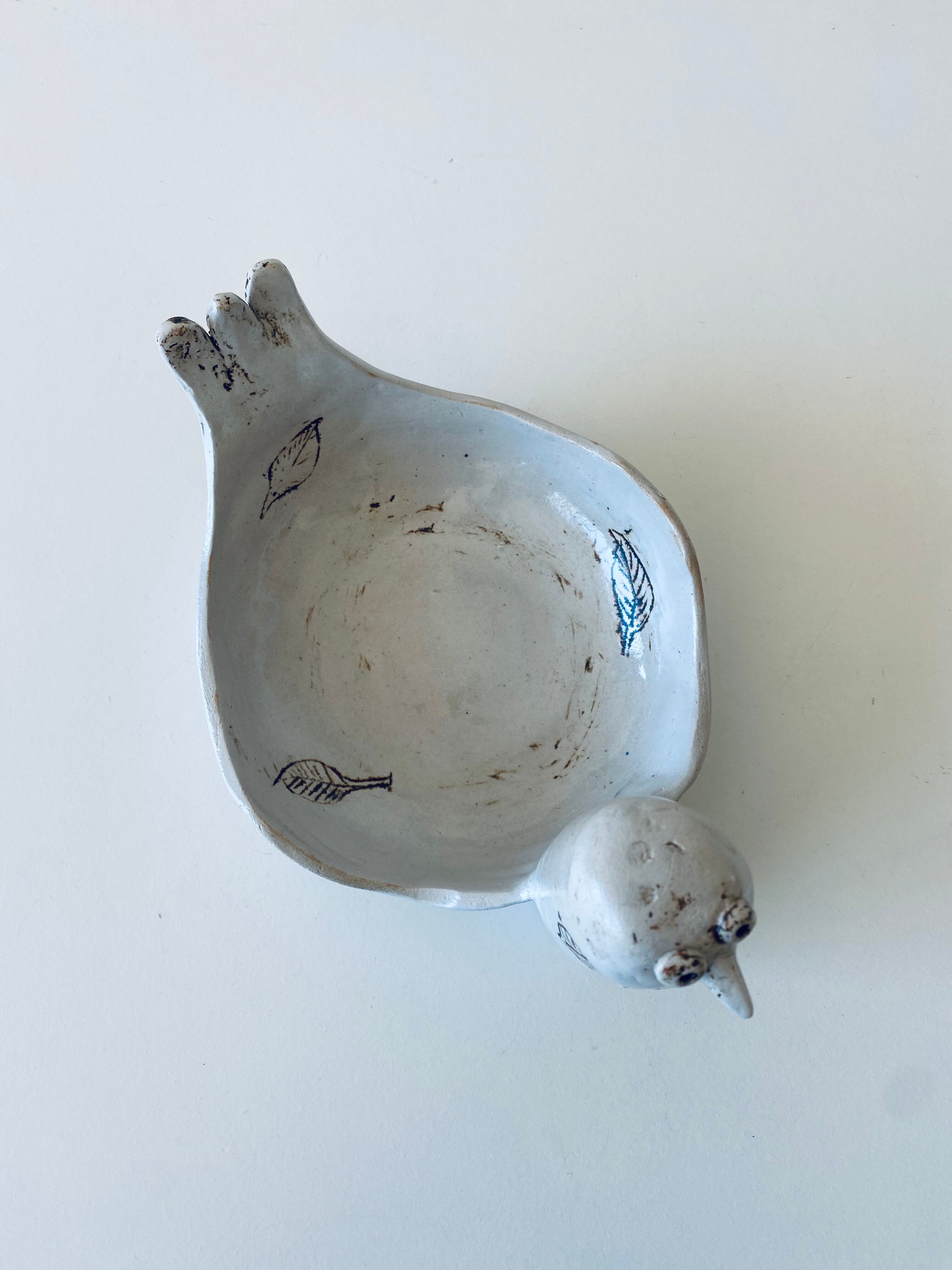 Large empty pocket or cup made of bird ceramic