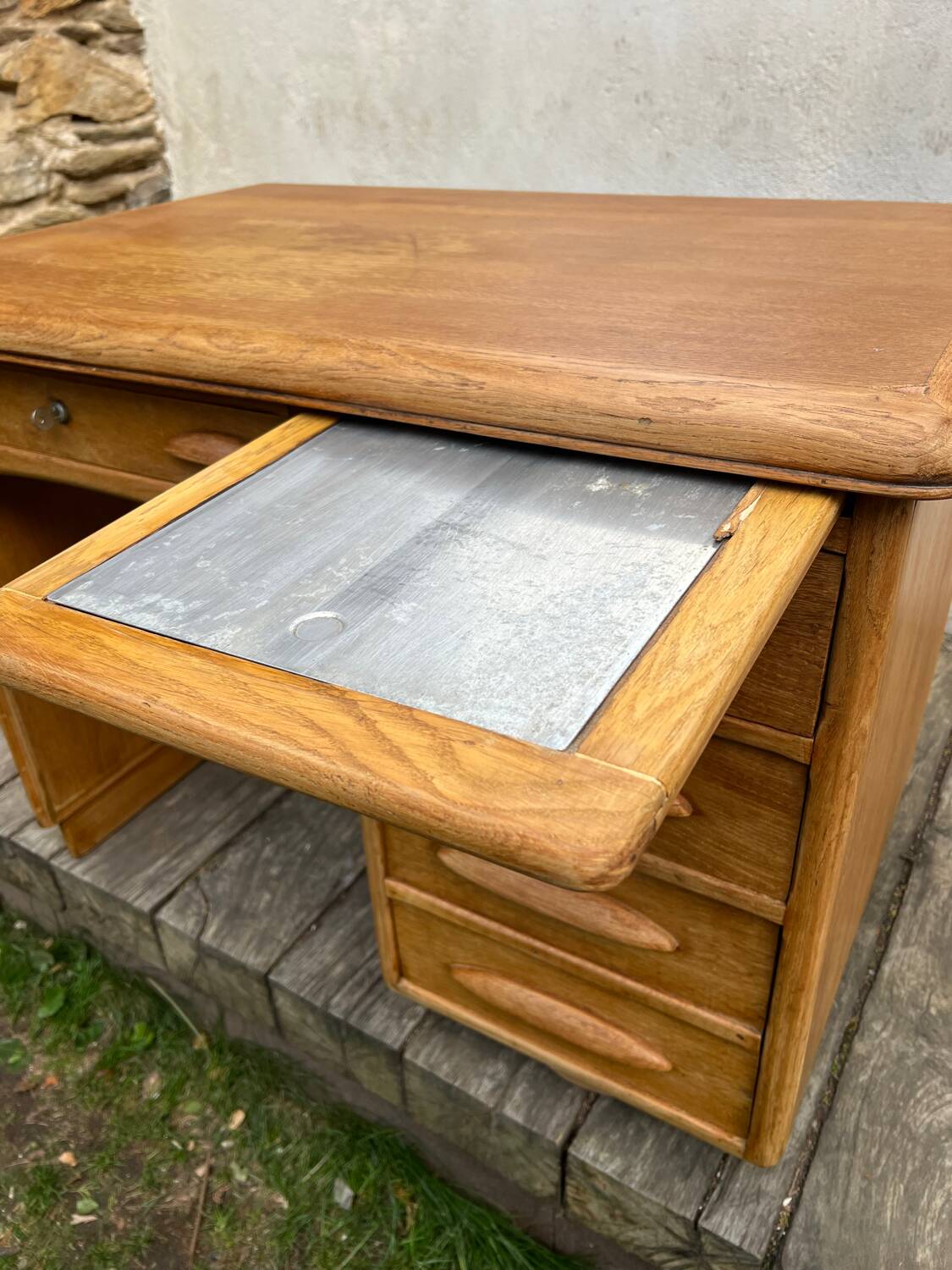 Antique light oak desk from the 1950s with 4 drawers