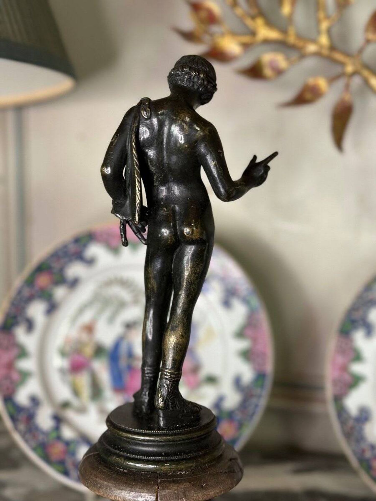 Narcissus, bronze after the antique on a wooden base, circa 1880.
