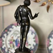 Narcissus, bronze after the antique on a wooden base, circa 1880.