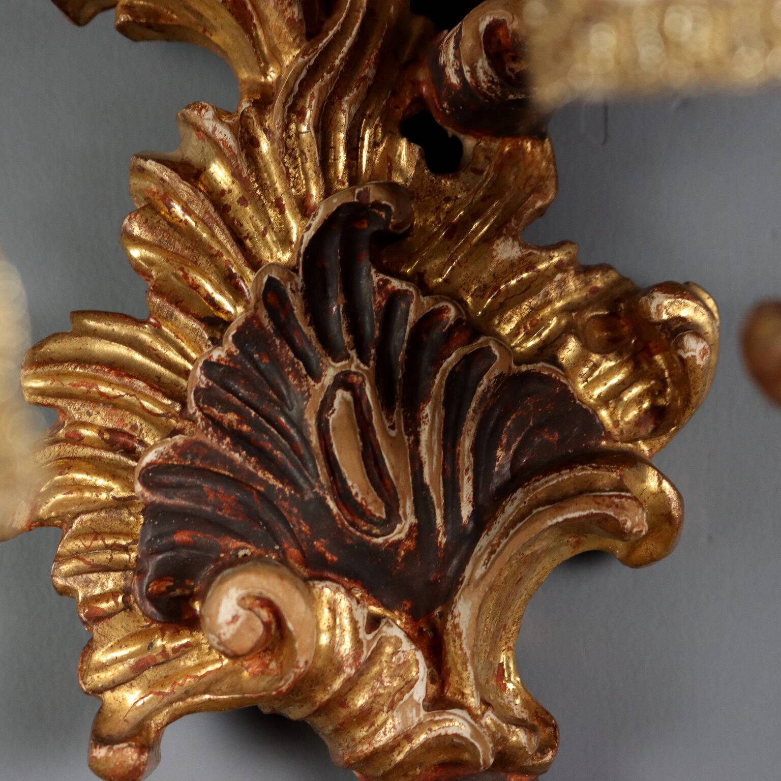 Antique wall sconces in carved lacquered and gilded wood, Italy, 20th century.