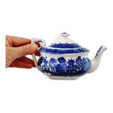 Small porcelain teapot or milk jug with the famous blue willow or weeping pattern