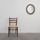 Miroir ovale néoclassique français en noir et or, 20e siècle