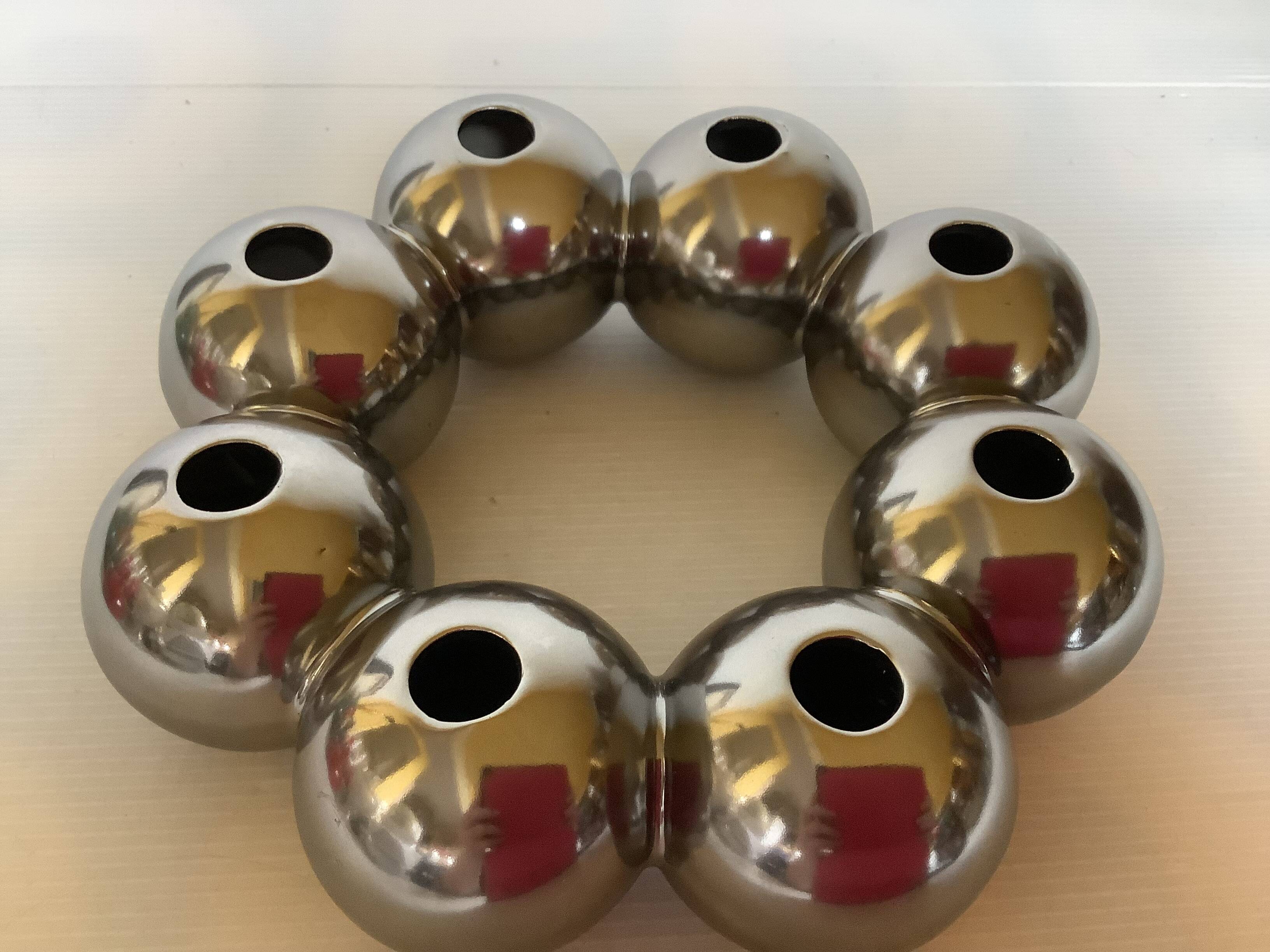 Silver flower vase in a crown shape.