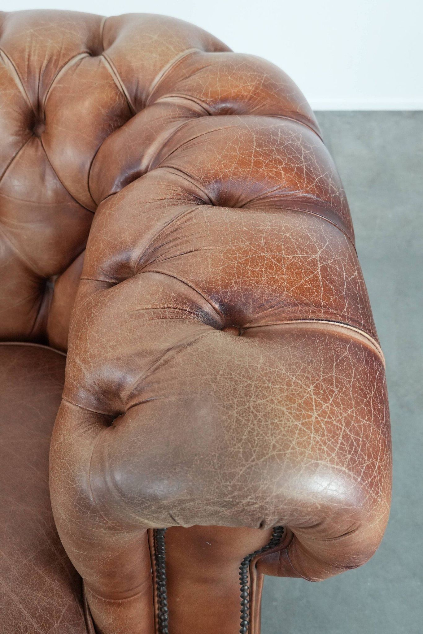 Chesterfield armchair in English style made of cowhide leather
