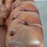 Chesterfield armchair in English style made of cowhide leather