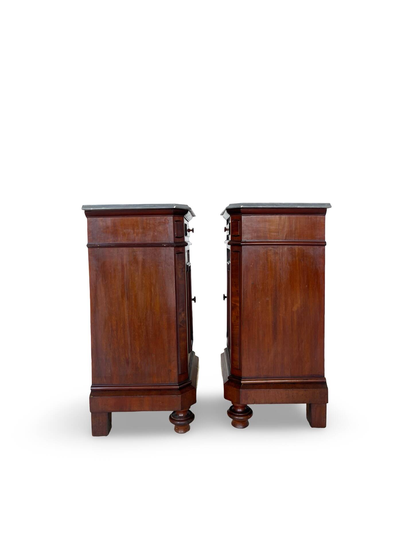 A pair of antique walnut bedside tables from the 1890s.