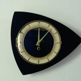 Famous black vintage mechanical wall clock
