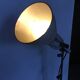 Industrial lamp on wrought iron tripod feet