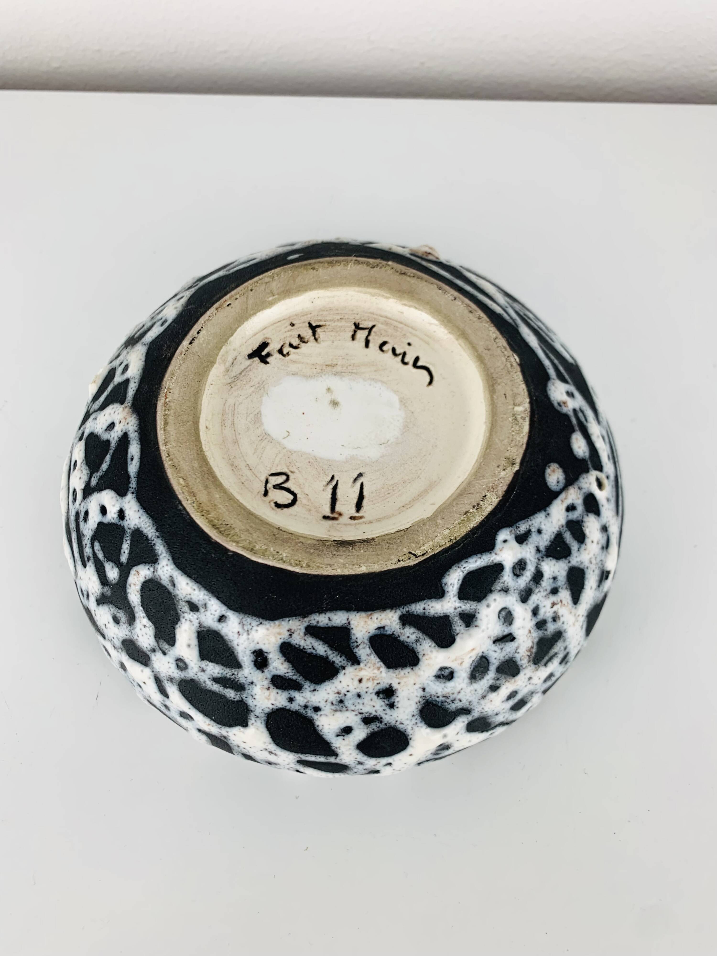 Ashtray and pocket tray by Marius Giuge, fat lava ceramic.