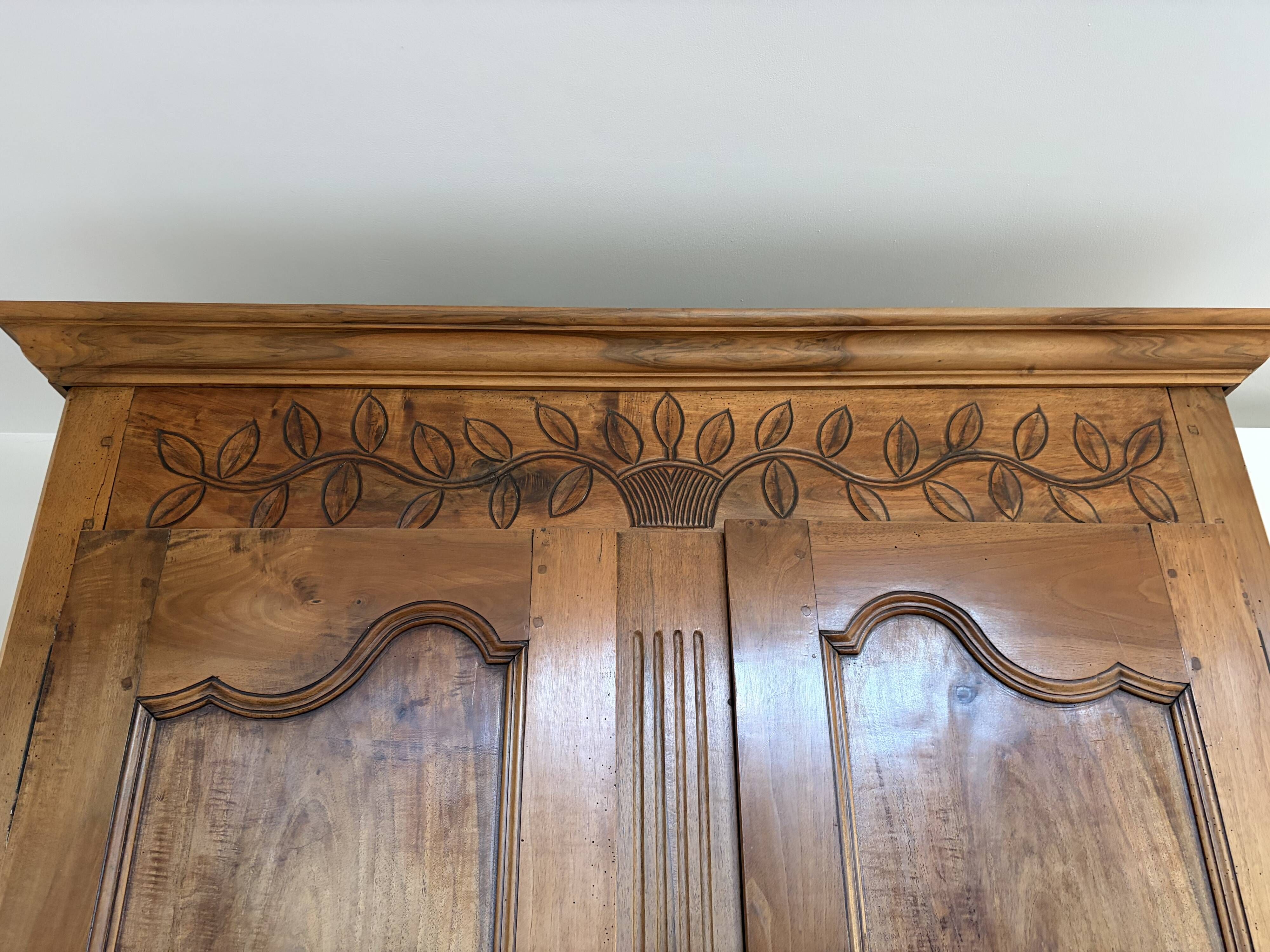 Beautifully decorated walnut wardrobe.