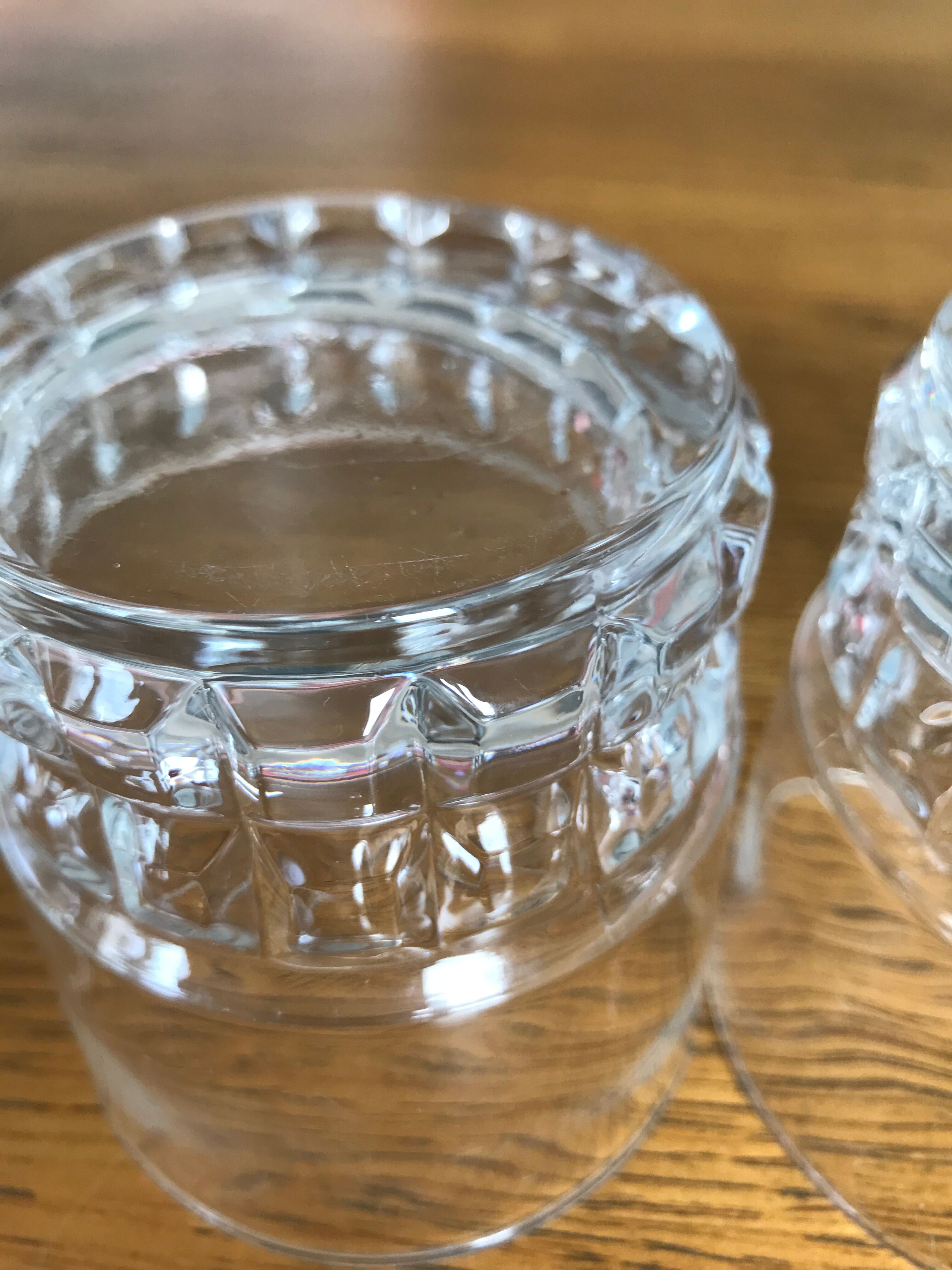 Mismatched decanter and whiskey glasses
