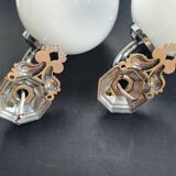 Pair of chrome wall sconces for bathroom with vintage fish pattern.