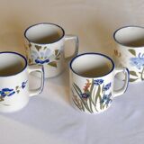 Set of 4 stoneware cups/mugs with blue floral designs, made in China.