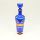Blue glass decanter with gold decoration