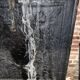 huge old fireplace plate has decoration of angels, crown and fleurs-de-lis